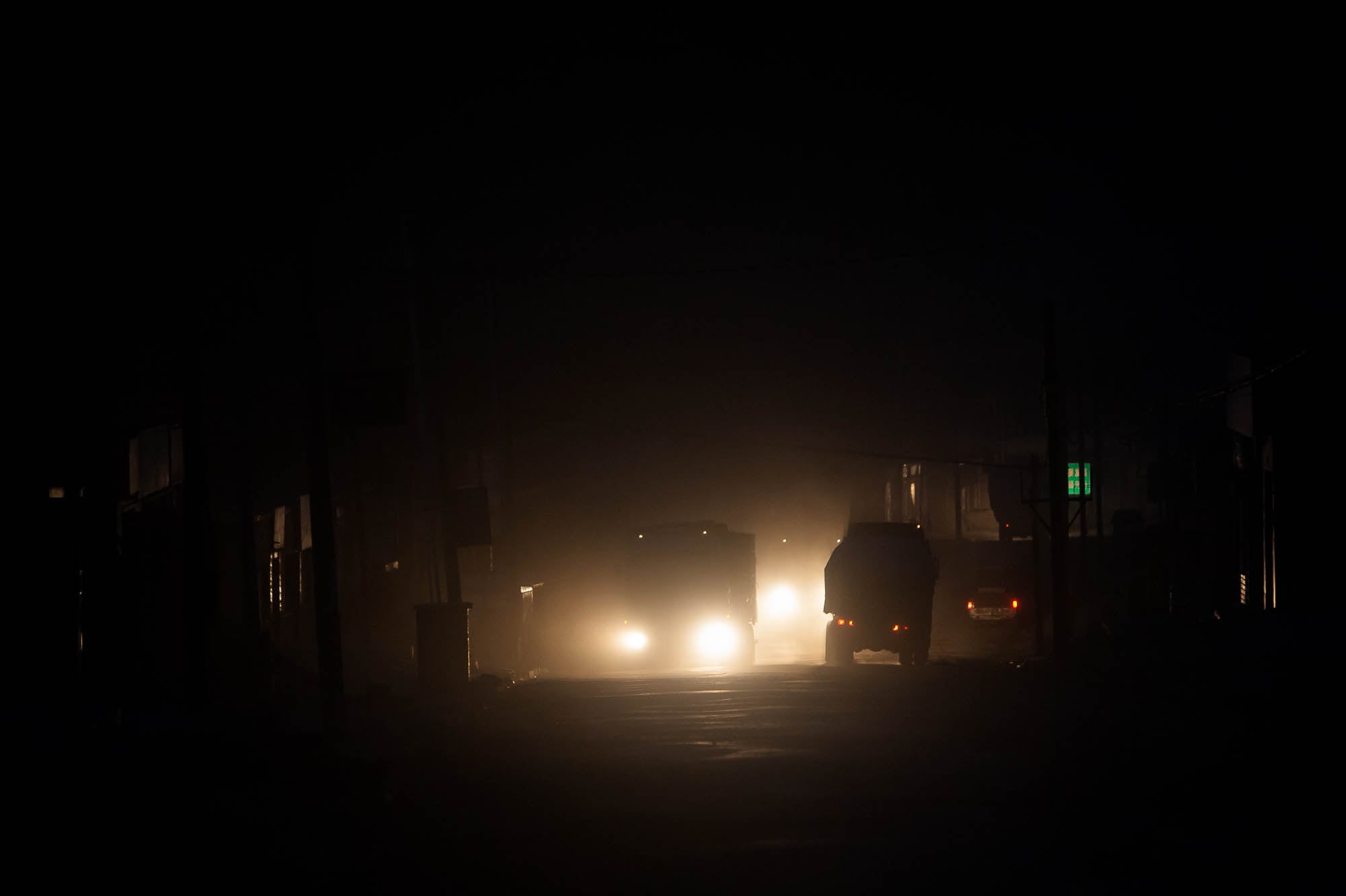 trucks in the darkness