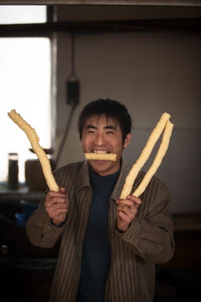 This friendly dude gave me puffed corn sticks on December 31st, 2007