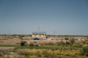 house with car near the Uzbek border