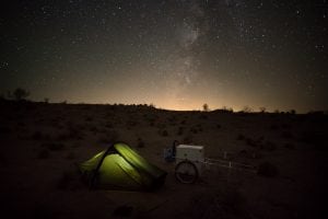 tent with light under milky way