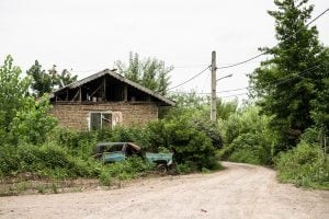 country house with broken car