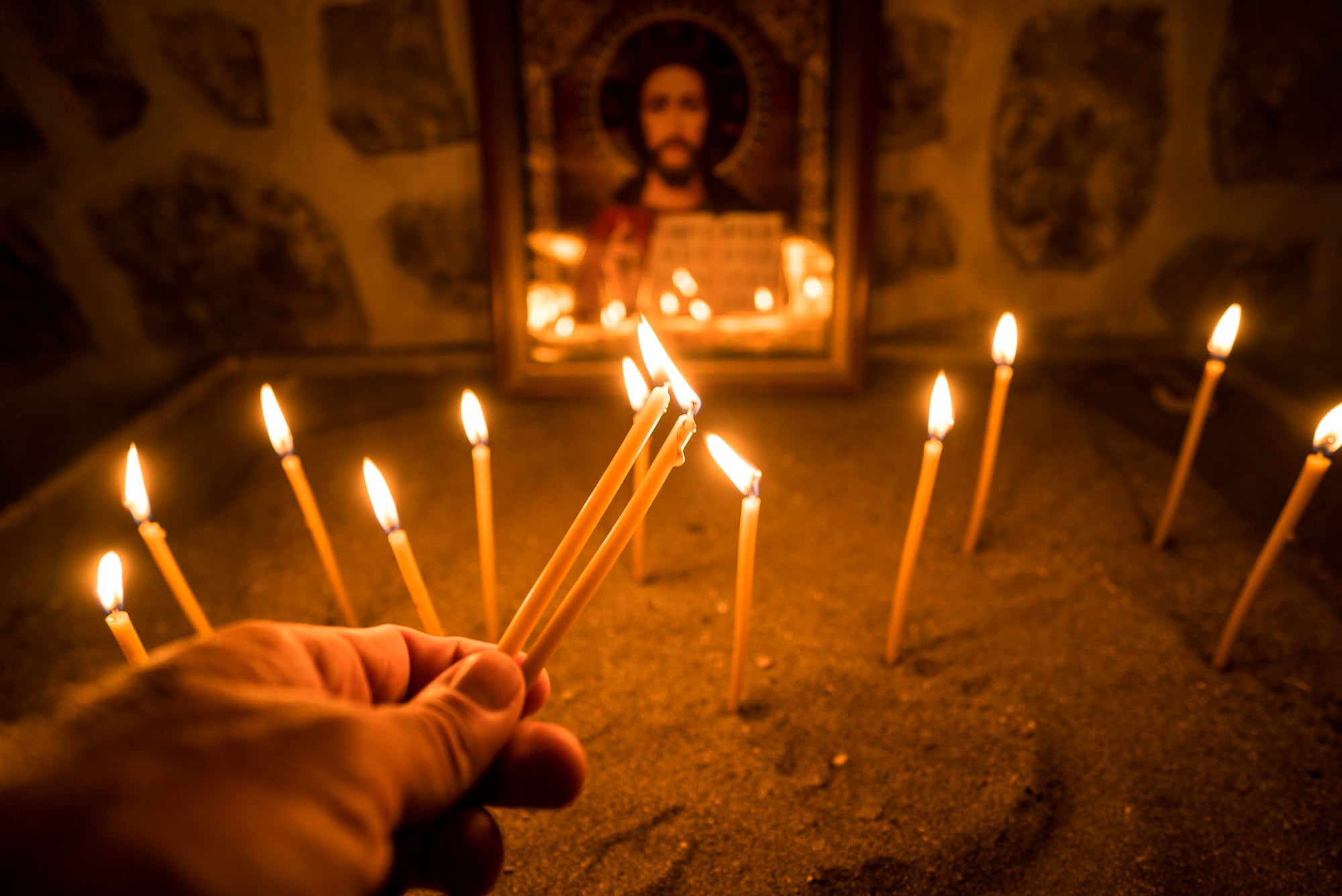 lighting candles in the Alban-Udi Church Chotari