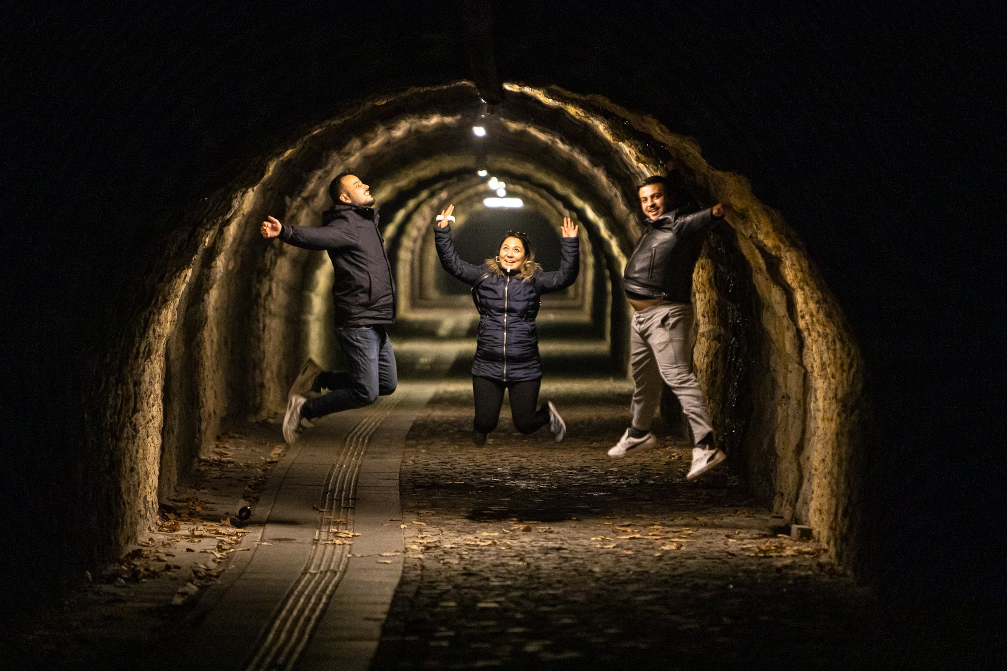 young people jumping in the Varagel Tunnel