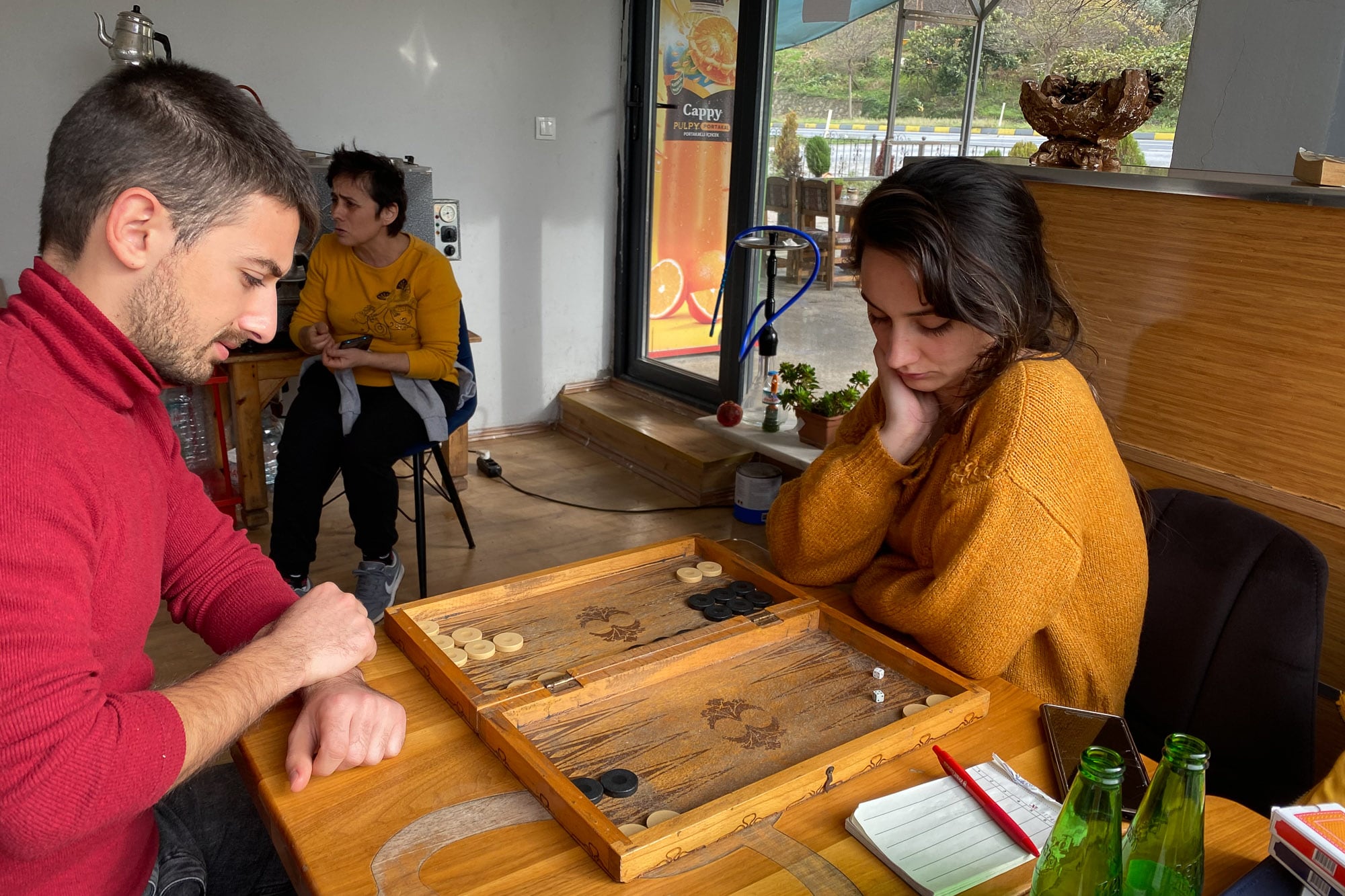 Café owners playing backgammon