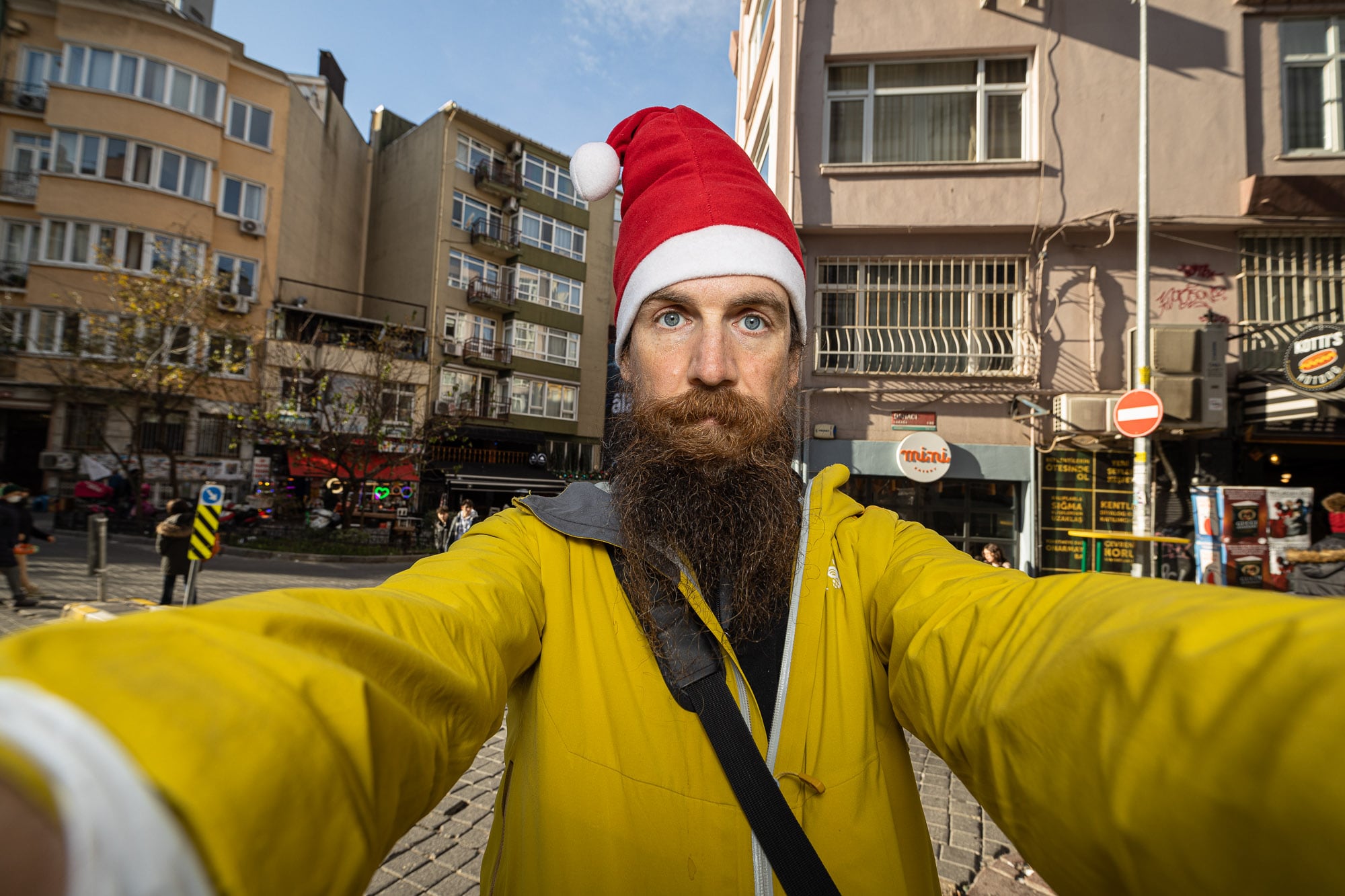 Worried in Kadiköy, wearing a Santa hat