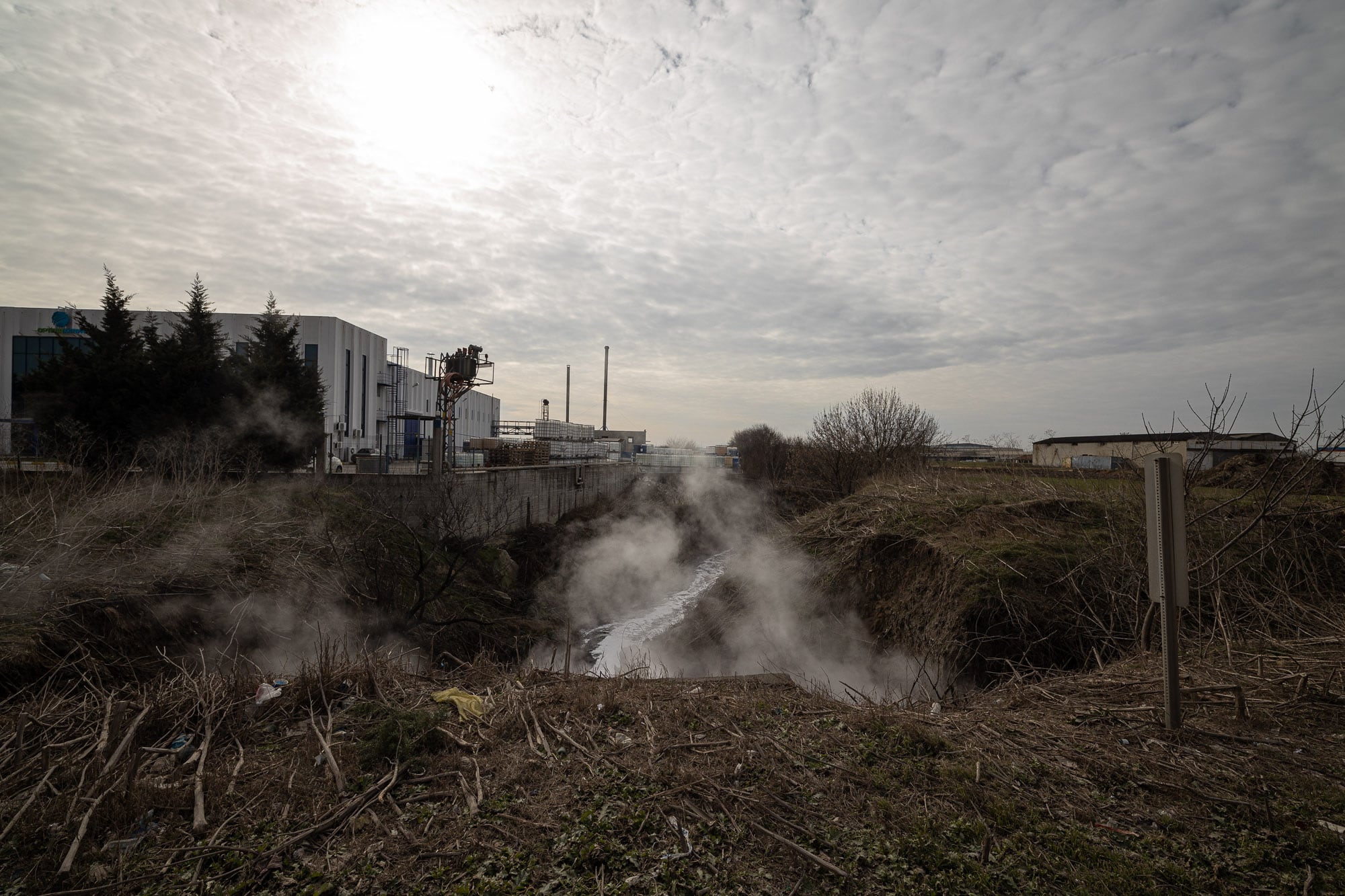 steam rising up from a polluted stream near Corlu