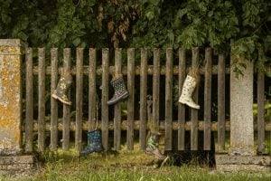 boots on a fence