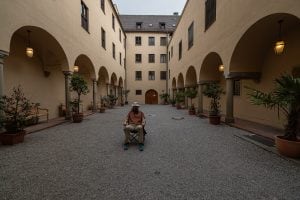I sit in the courtyard of the Fugger House in Augsburg.