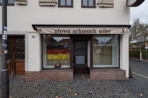 vacant shop with a German flag in the window